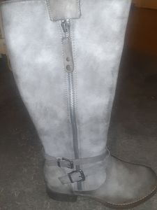 Grey zip up boots ,size 10 ,with buckles on bottom ,knee high.